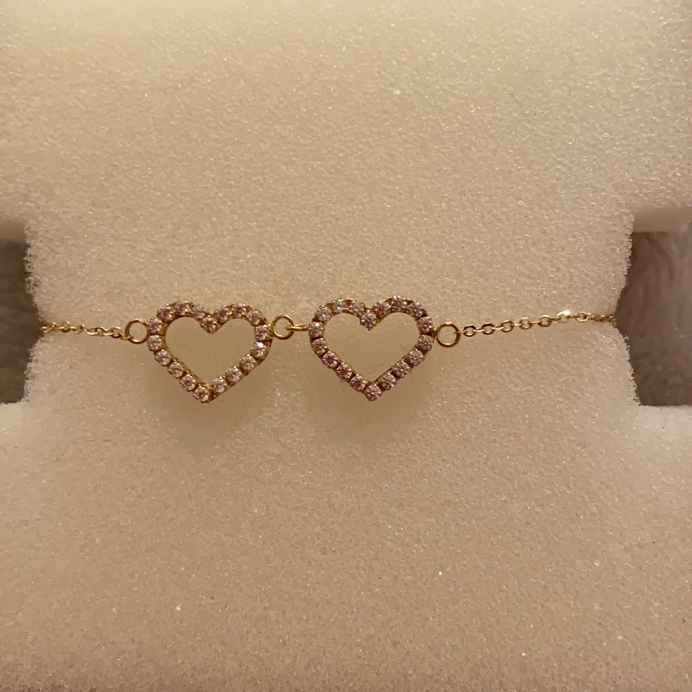One size 2 diamond hearts 10k gold bracelet